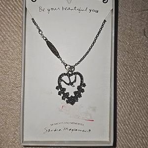 Beautiful piece stainless steel.dove flying over a bed of roses!